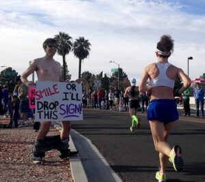 Funny marathon signs - Smile or it drops by Jeff Moriarty from Flickr, used with permission