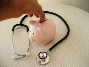 Stethoscope and piggy Bank by 401(K) 2013 from Flickr